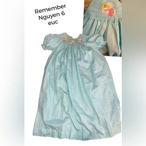 Remember Nguyen smocked long bishop angel dress